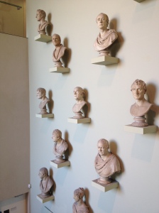 image of lots of busts on a wall